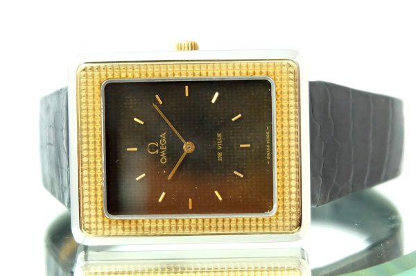 Omega Tank Clous de Paris or acier 1974